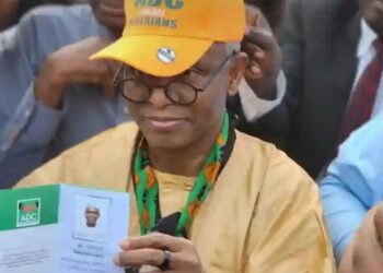 Malam Nasir El-Rufai displays his African Democratic Congress (ADC) membership card