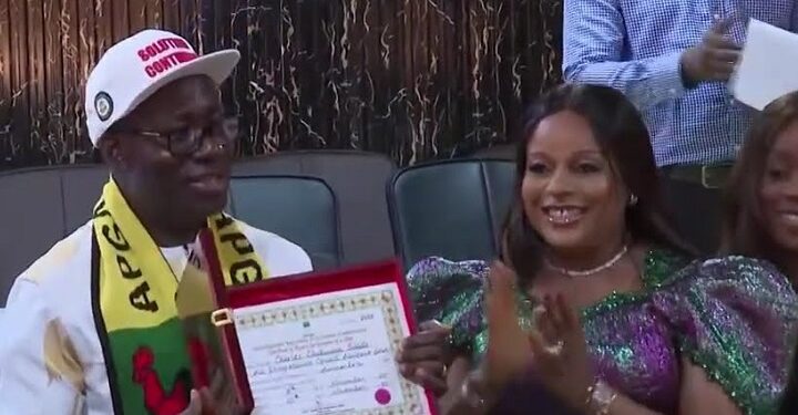 Anambra State Governor, Prof. Chukwuma Charles Soludo, shows off the the Certificate of Return