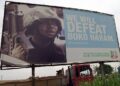 "We will defeat Boko Haram" signpost in Borno State