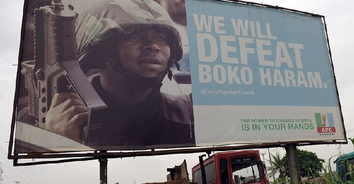 "We will defeat Boko Haram" signpost in Borno State