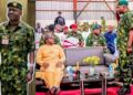 General Christopher Gwabin Musa saluting his former boss, the Minister of State for Defence, Bello Matawalle