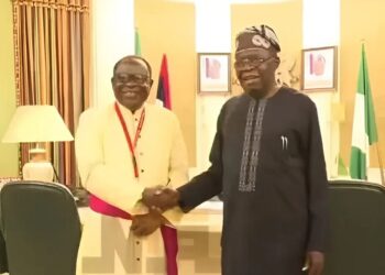 President Bola Ahmed Tinubu shaking hands with Catholic Bishop of Sokoto Diocese, Rev. Matthew Hassan Kukah