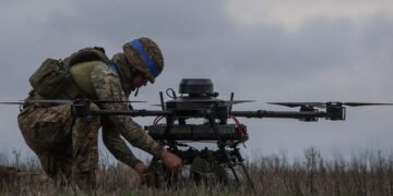 Ukrainian soldier setting of a drone for attack