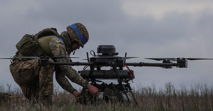 Ukrainian soldier setting of a drone for attack