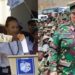 South Africa's legendary President Nelson Mandela, voting in the country's first all-race polls in April 1994 & Tanzanian President Samia Hassan in military fatigues.