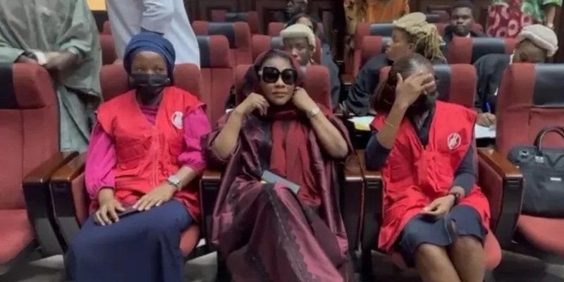 EFCC officials with Aisha Achimugu in Nigerian courtroom