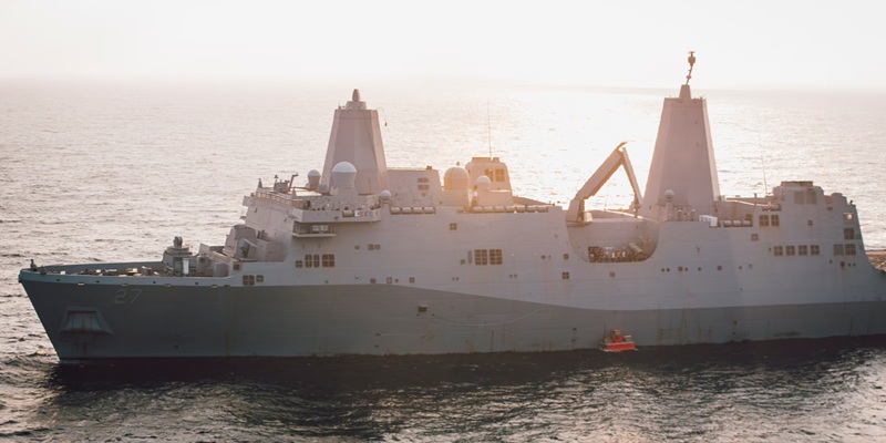 Amphibious transport dock ship USS Portland (LPD 27) lowers a static surface training target into the Gulf of Aden before conducting a high-energy laser weapon system demonstration, Dec. 14. During the demonstration, the Solid State Laser – Technology Maturation Laser Weapons System Demonstrator Mark 2 MOD 0 aboard Portland successfully engaged the training target.