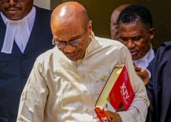 Ex-Central Bank Governor Godwin Emefiele clutching a jumbo-size Bible during a court appearance