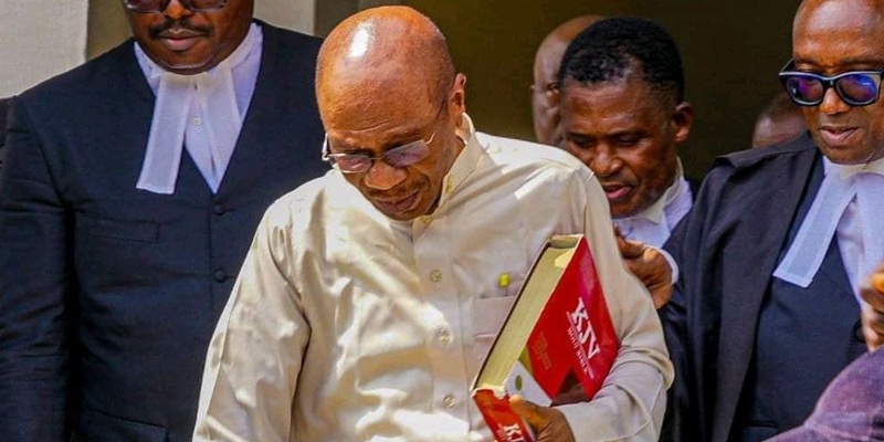 Ex-Central Bank Governor Godwin Emefiele clutching a jumbo-size Bible during a court appearance