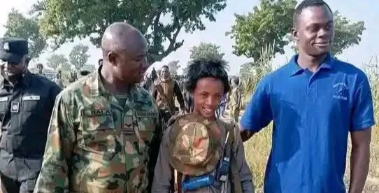 VIRAL: Soldiers Seen in Photo Ops with Boy-Bandit