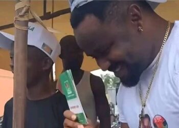 Popular Nollywood Star Zubby Michael displays his ADC membership card