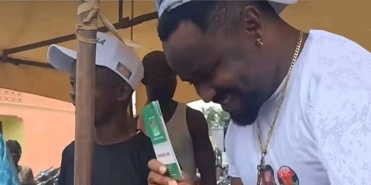 Popular Nollywood Star Zubby Michael displays his ADC membership card