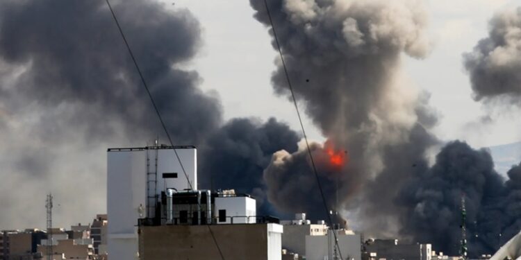 Smoke rises from a strike in Tehran, Iran