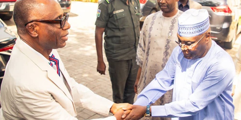 Atiku Abubakar and Chibuike Rotimi Amaechi in a handshake