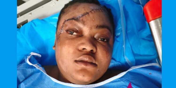 Ugochukwu (Ugochi) Nwabugo in a hospital bed