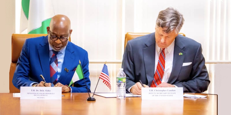 Dele Alake and Christopher Landau signing the mining memorandum of understanding (MOU)