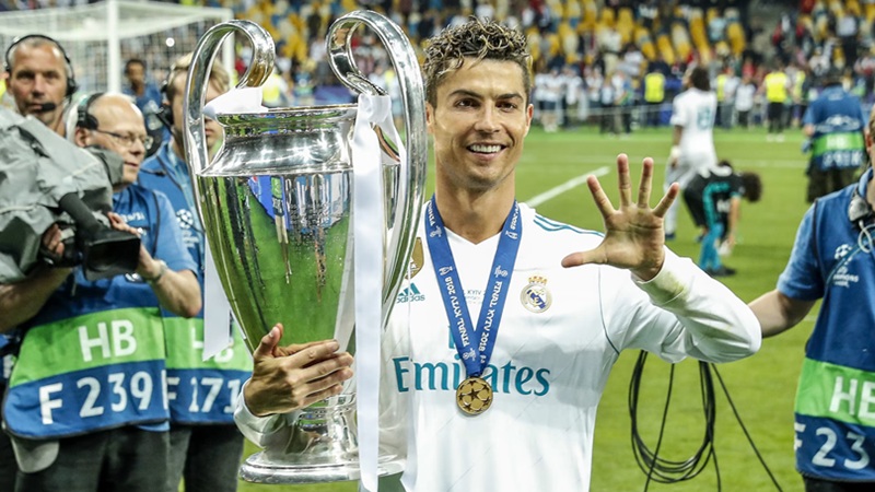 Cristiano Ronaldo displays the UEFA Champions League trophy he won with Real Madrid