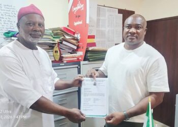 Dr. Roy Chinweuba (left) receiving certificate of return as the President General of Abba Town Union on Anambra State