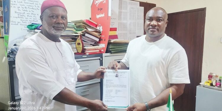 Dr. Roy Chinweuba (left) receiving certificate of return as the President General of Abba Town Union on Anambra State